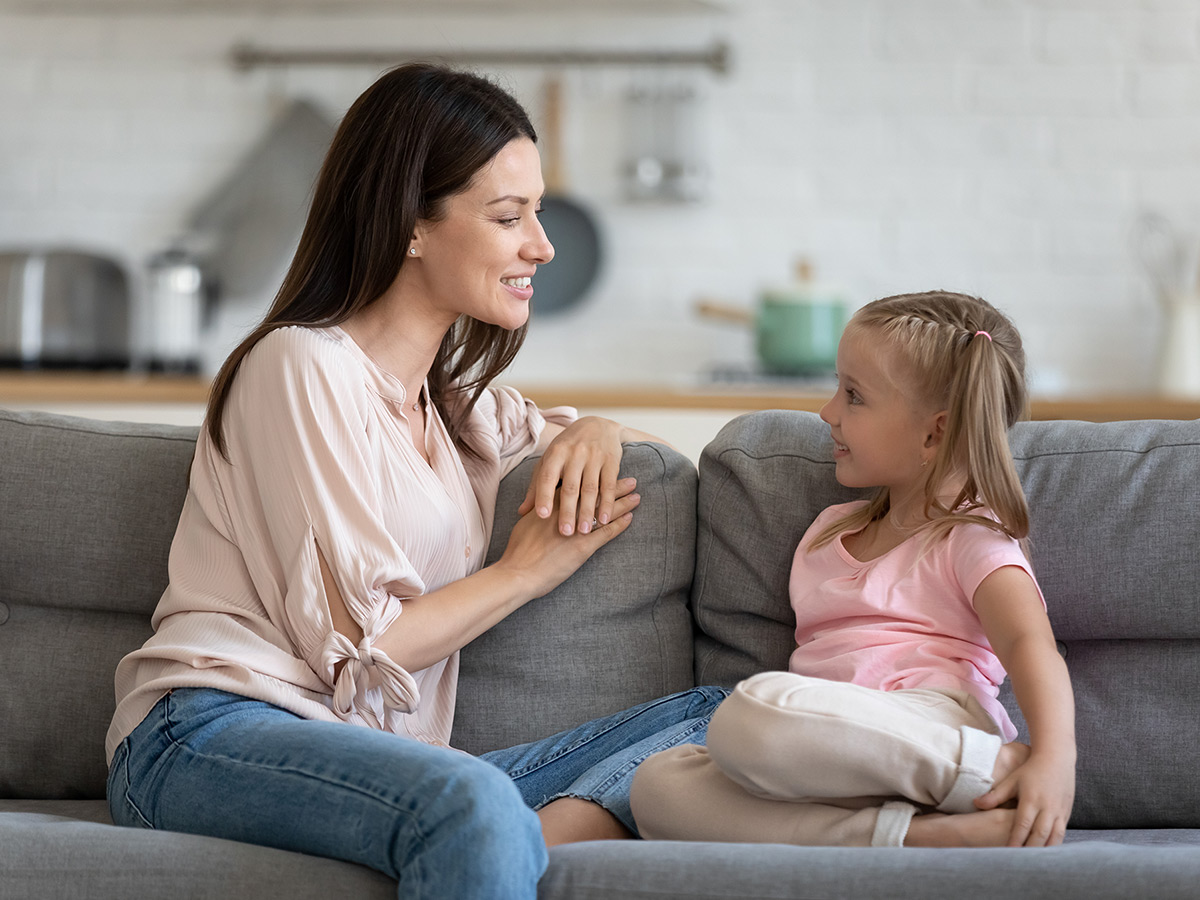 A mother having a conversation with her daughter