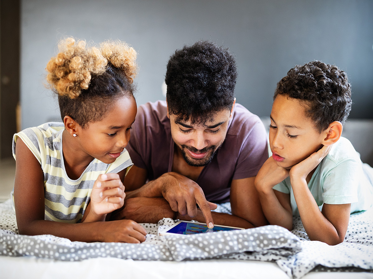 A father learning about autism as a spectrum with his kids