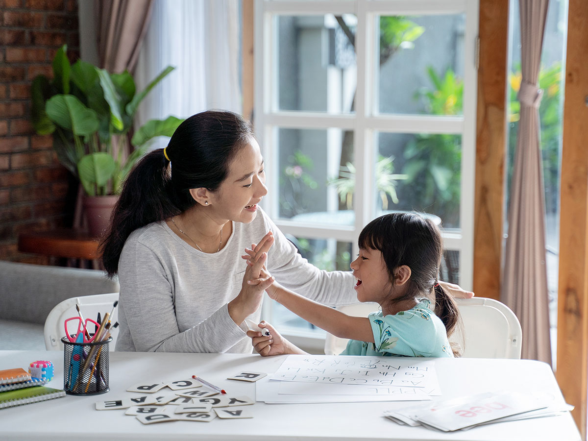 Parent teaching daughter