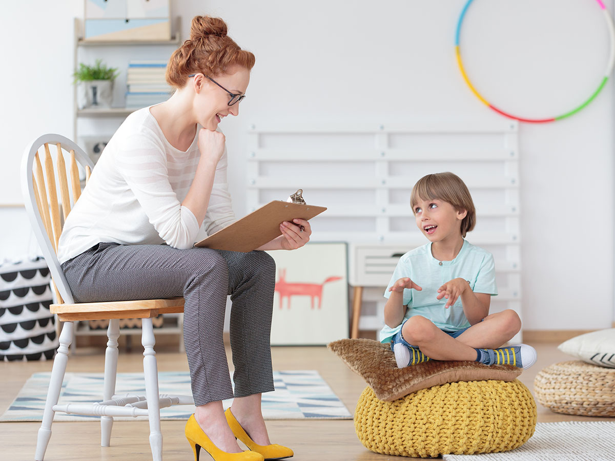 Therapist talking with boy