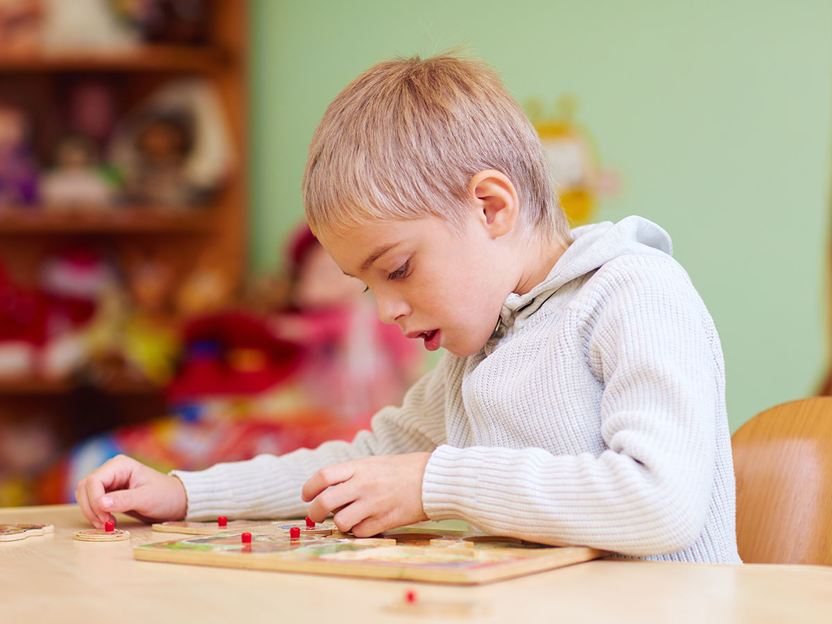 Kid working on a puzzle