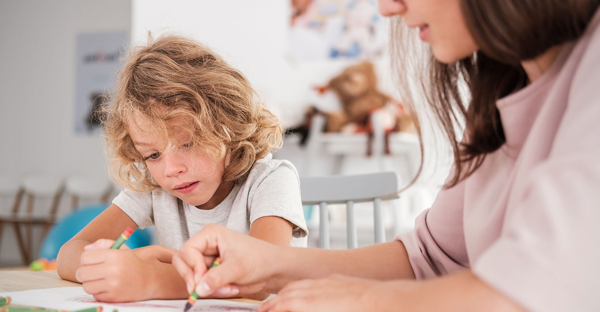 Person helping child with work