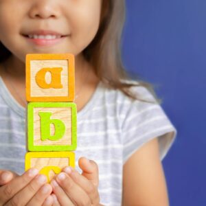 smiling child with blocks