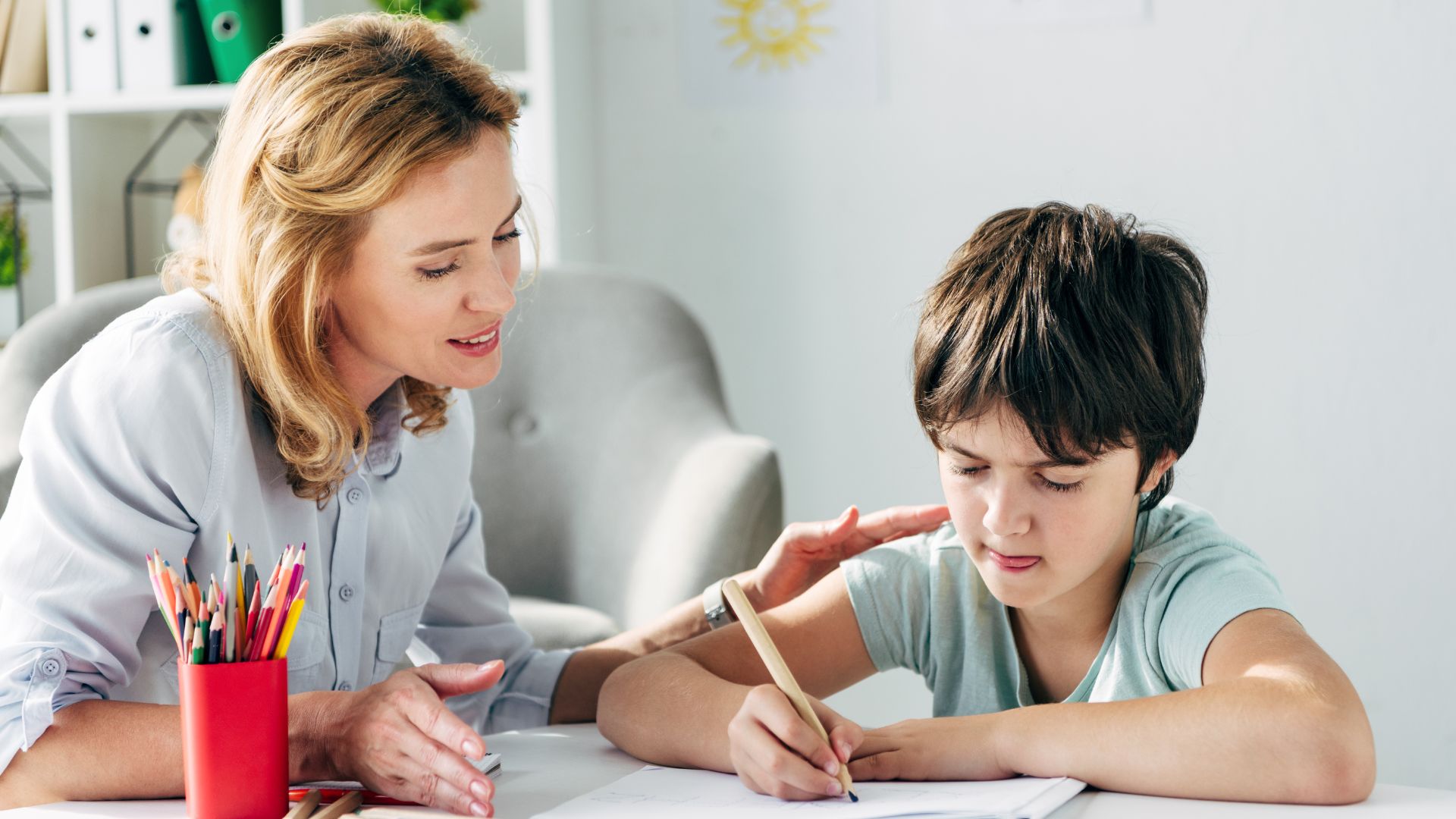 autistic boy and teacher