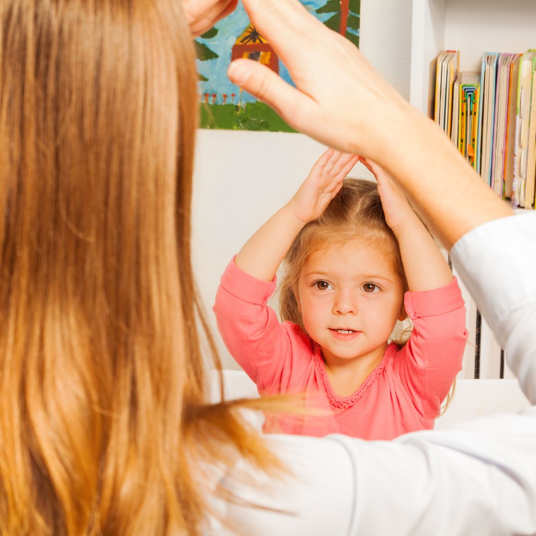 child with therapist