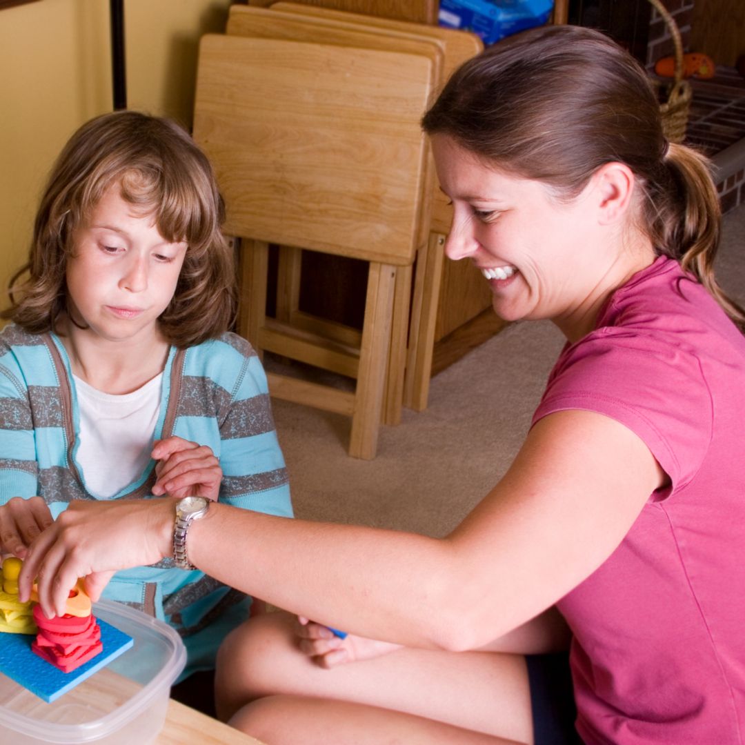 Therapist and child working together