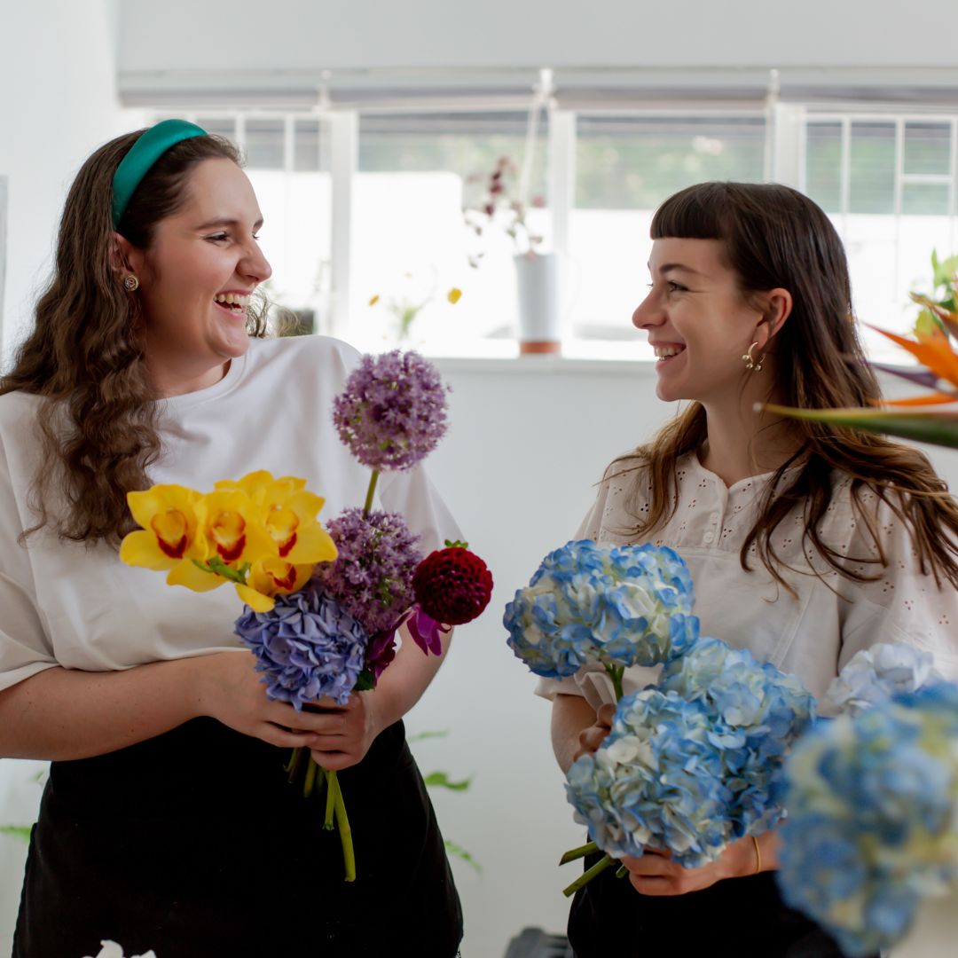 adults holding flowers