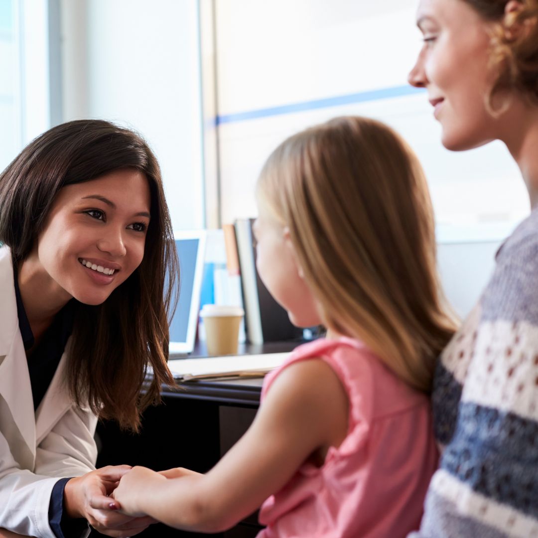 Mother and daughter meeting with doctor