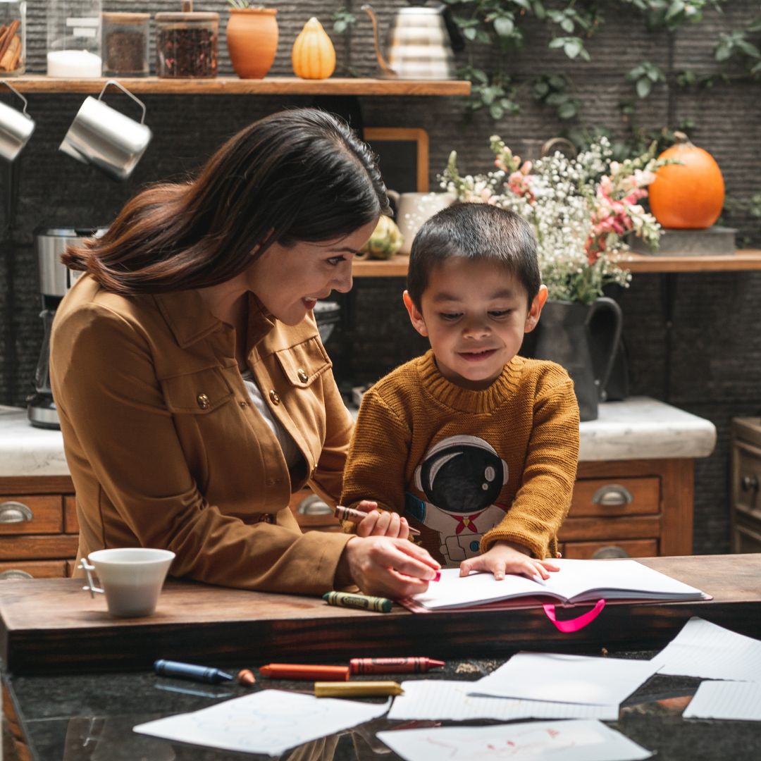 woman working with a little boy