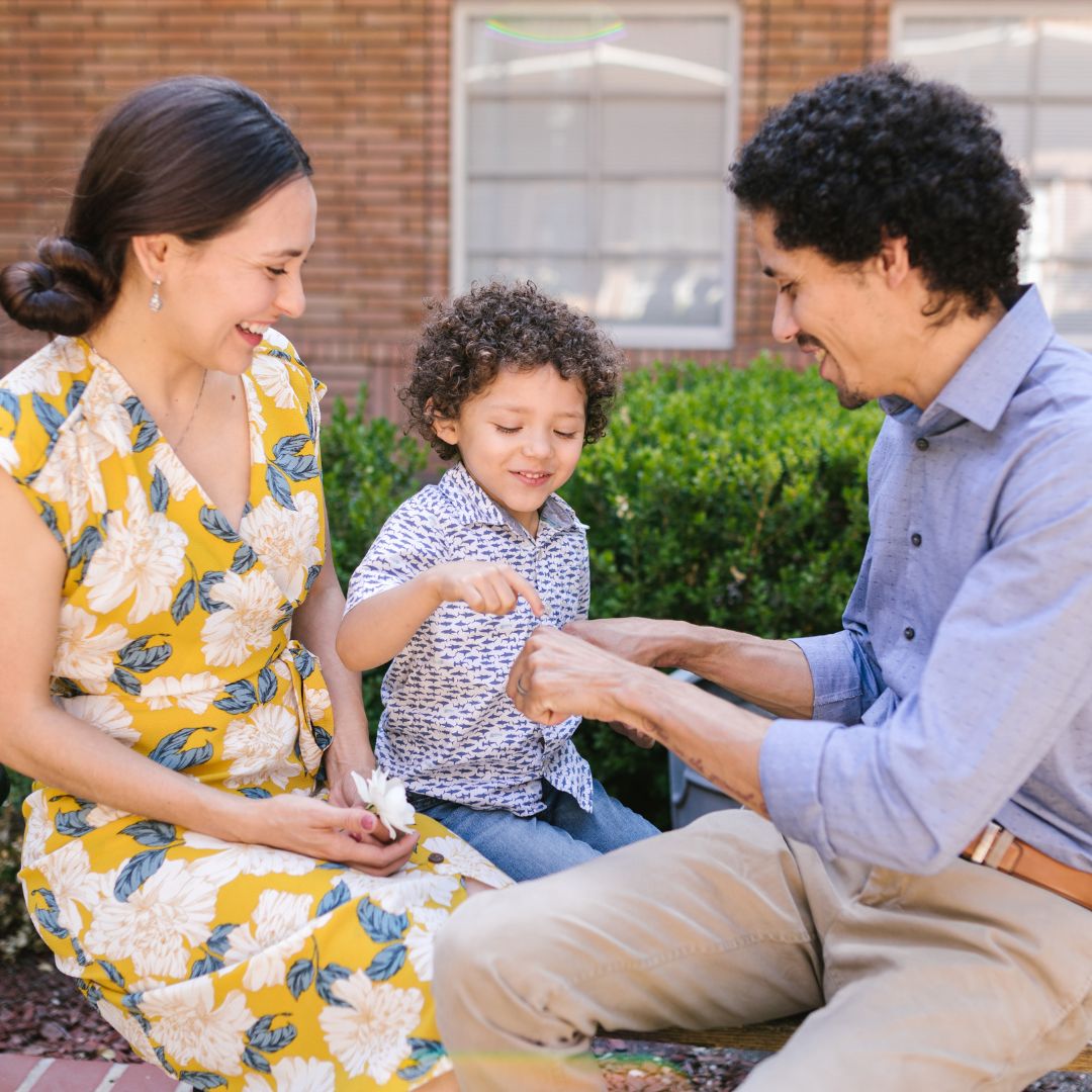 family sitting outside
