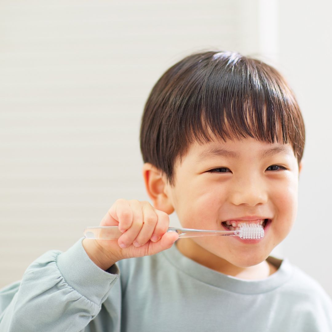 child brushing teeth