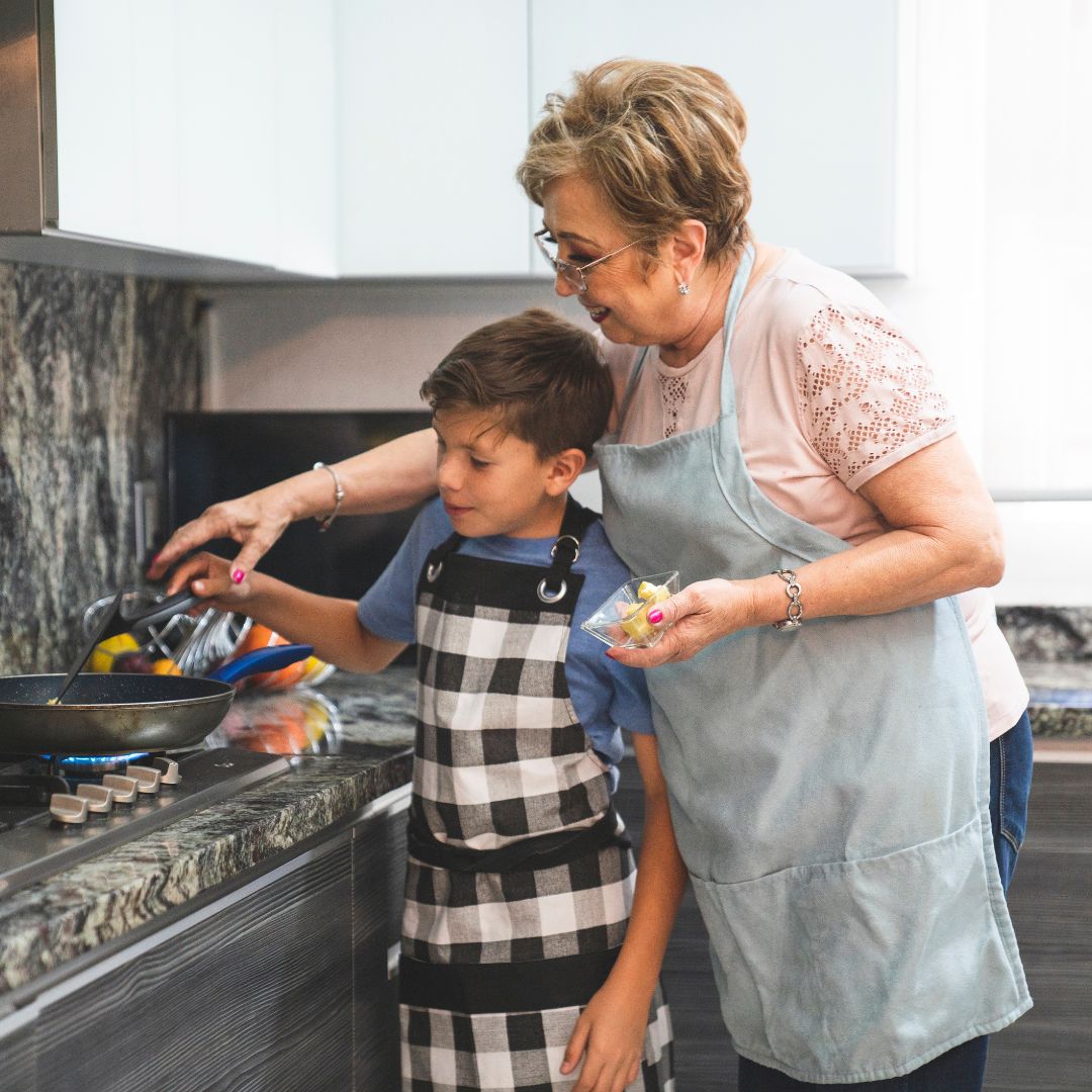 child and woman cooking
