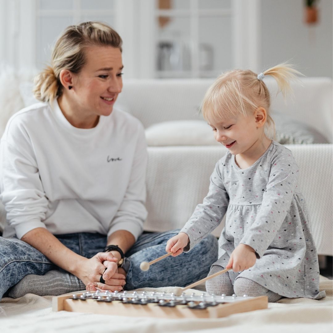 therapist playing music with child