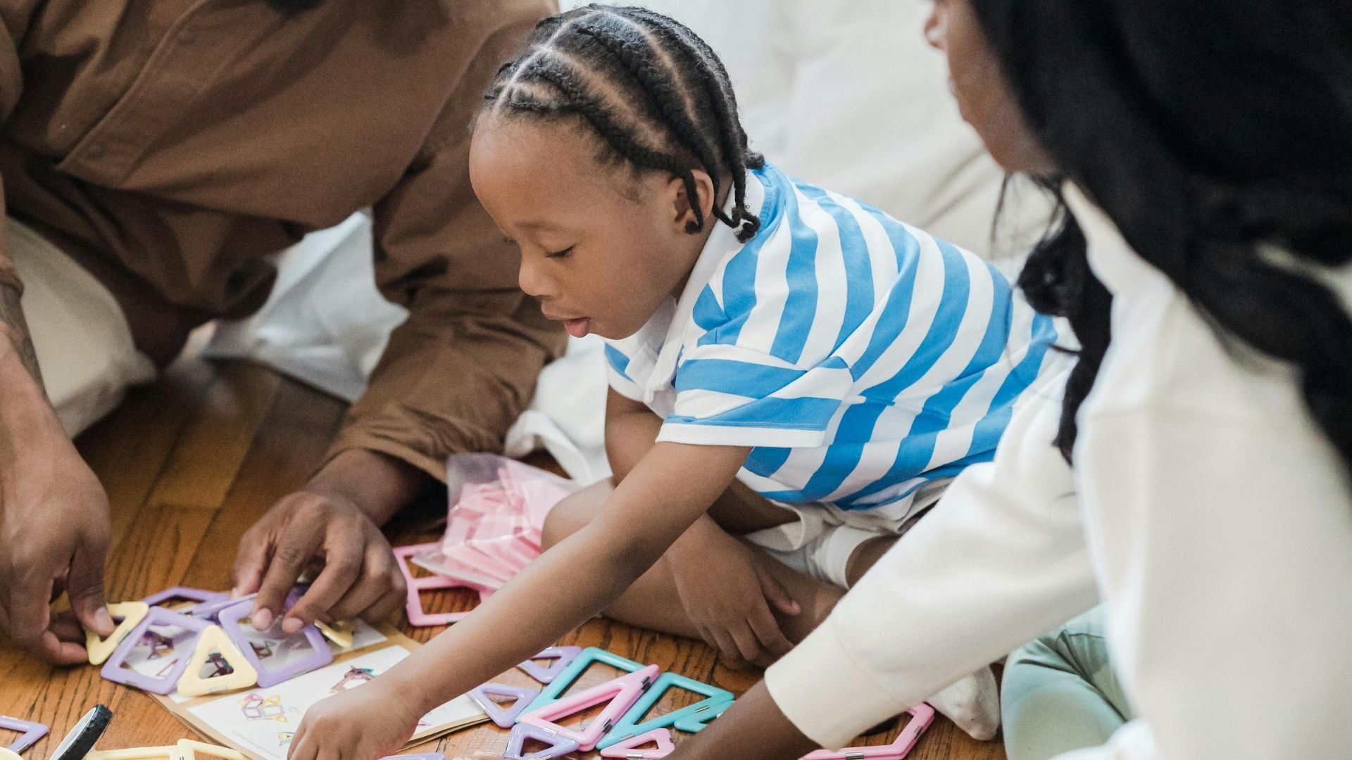 playing with magnetic toy with child