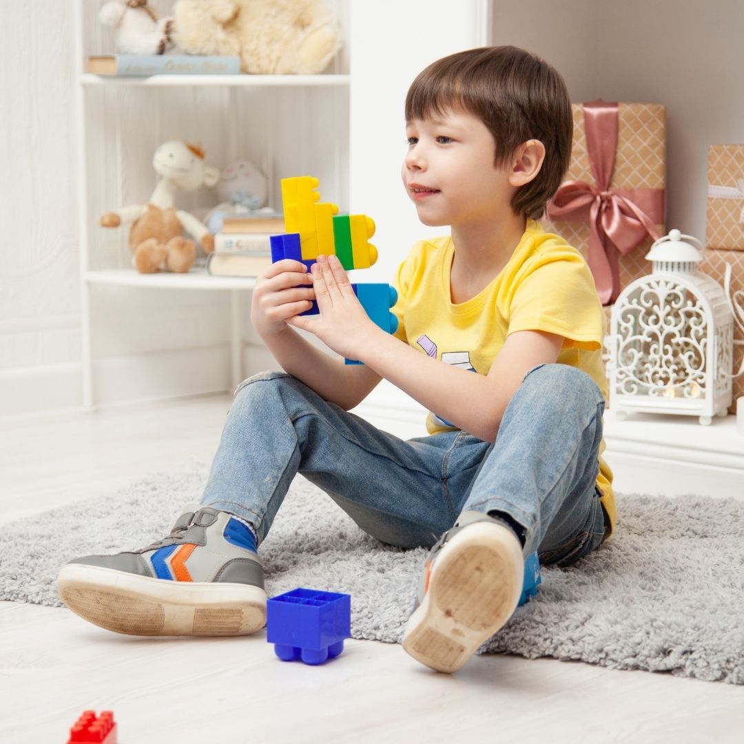 child playing with legos