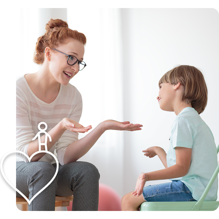 a therapist and young boy laughing